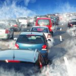 A ROAD FILLED WITH TRAFFIC AND ALL CARS ARE EMITTING TOXIC SMOKE
